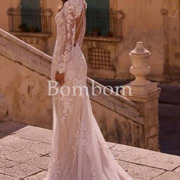 Vestido de novia blanco con mangas espalda descubierta con pedreria colección 2025 - Imagen 1